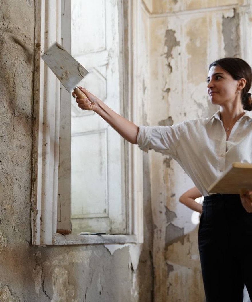 Plaster being applied to a wall during restoration work